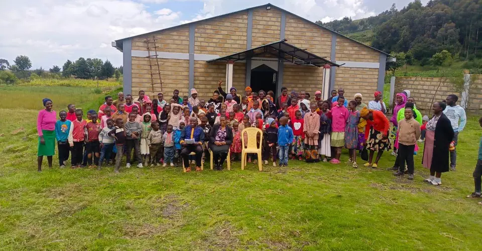 A community gathered outside a mission church in Kenya